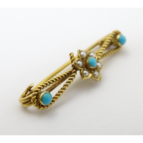 316 - A c1900 gold and gilt metal brooch set with turquoise and seed pearls. 1 1/4'' long