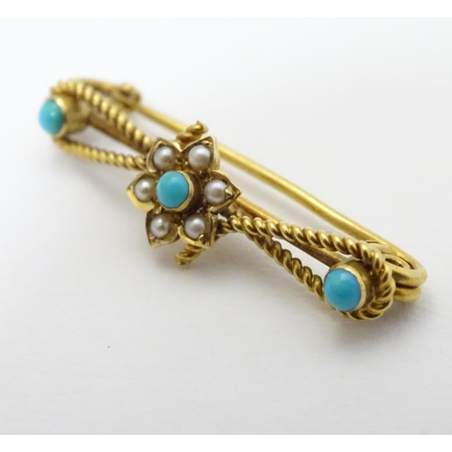 316 - A c1900 gold and gilt metal brooch set with turquoise and seed pearls. 1 1/4'' long