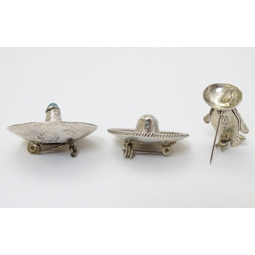 319 - 3 various mid-late 20thC Mexican silver brooches comprising 2 formed as sombreros one set with turqu... 