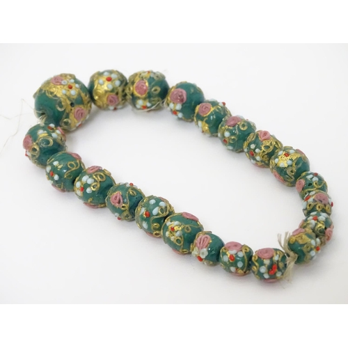 326 - 21 graduated Venetian glass beads with hand painted decoration. The largest approx ½'' diameter