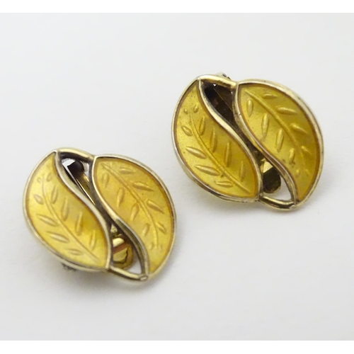 328 - Scandinavian Jewellery: A pair of Norwegian silver gilt earrings of leaf form with yellow enamel dec... 