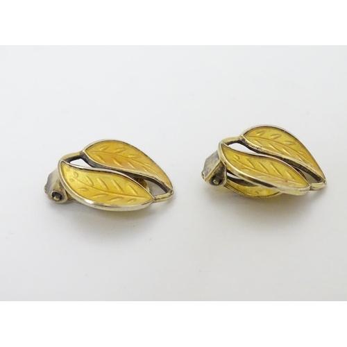 328 - Scandinavian Jewellery: A pair of Norwegian silver gilt earrings of leaf form with yellow enamel dec... 