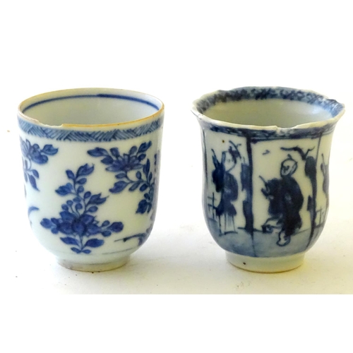 33 - Two Chinese blue and white teacups, one decorated with flowers and foliage, the other with figures. ... 