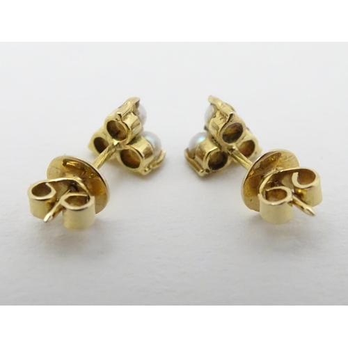 330 - A pair of gold stud earring set with pearls