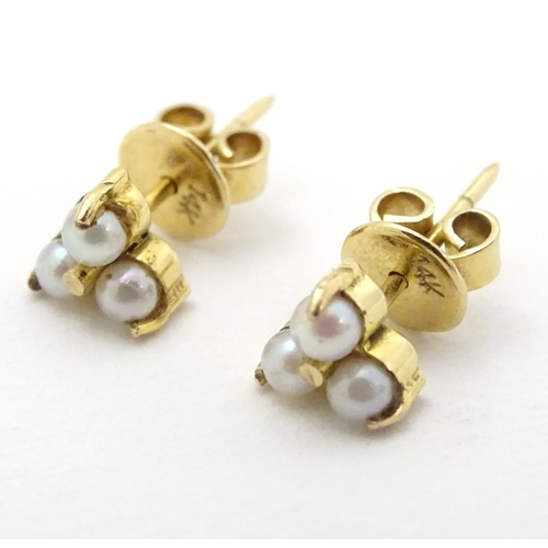 330 - A pair of gold stud earring set with pearls