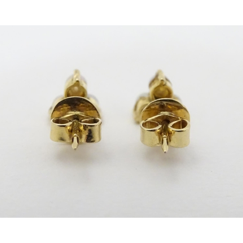 330 - A pair of gold stud earring set with pearls