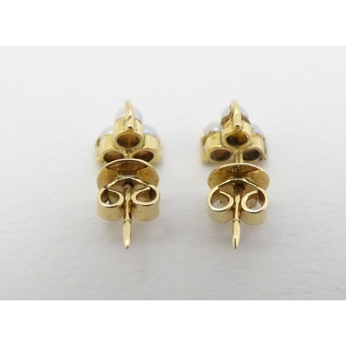 330 - A pair of gold stud earring set with pearls