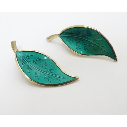 332 - Scandinavian Jewellery: A pair of Norwegian silver gilt earrings of leaf form with green enamel deco... 