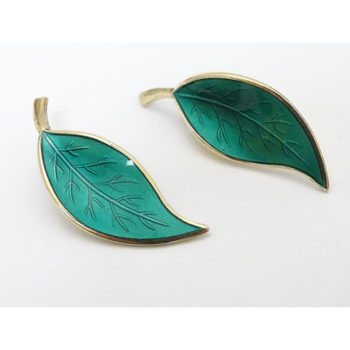 332 - Scandinavian Jewellery: A pair of Norwegian silver gilt earrings of leaf form with green enamel deco... 