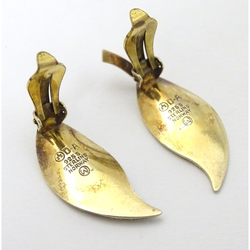 332 - Scandinavian Jewellery: A pair of Norwegian silver gilt earrings of leaf form with green enamel deco... 