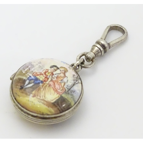 335 - A 19thC double sided locket with enamel decoration depicting figures in a landscape approx 7/8'' dia... 