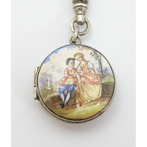 335 - A 19thC double sided locket with enamel decoration depicting figures in a landscape approx 7/8'' dia... 