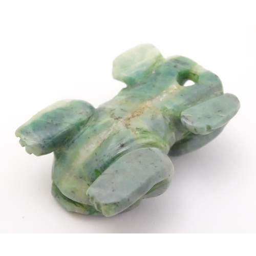 338 - A carved green pendant formed as a frog 1 1/4''