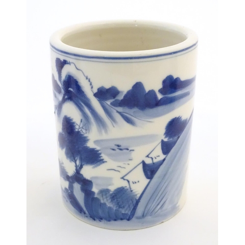 34 - Three assorted Chinese ceramics comprising a blue underglaze brush pot with a mountainous landscape,... 