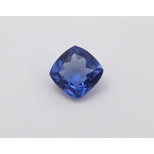 347 - Unmounted stone: A blue cushion cut tanzanite, approx 8.10 ct, approx 3/8'' wide