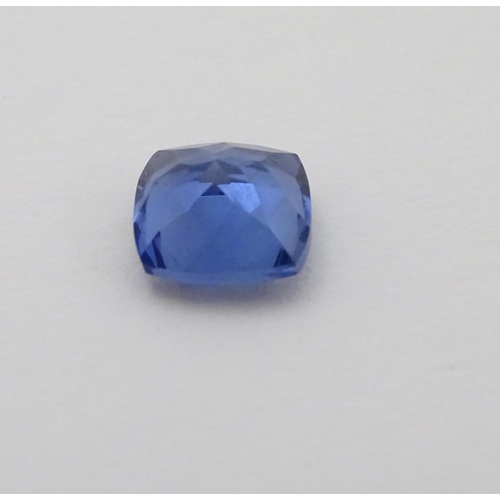 347 - Unmounted stone: A blue cushion cut tanzanite, approx 8.10 ct, approx 3/8'' wide