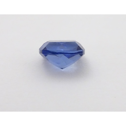 347 - Unmounted stone: A blue cushion cut tanzanite, approx 8.10 ct, approx 3/8'' wide