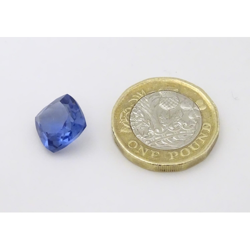 347 - Unmounted stone: A blue cushion cut tanzanite, approx 8.10 ct, approx 3/8'' wide