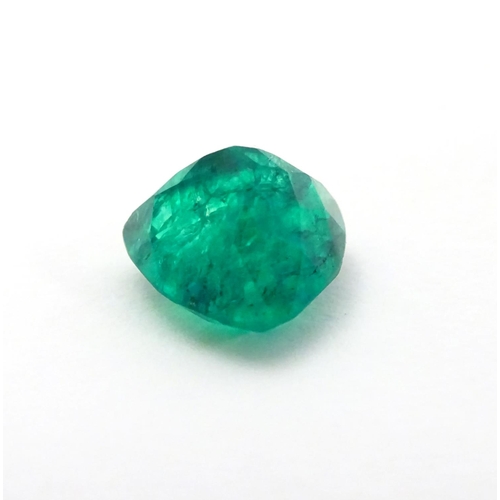 348 - Unmounted stone: A green trillion cut emerald. approx 6.90 ct, approx 3/8'' wide