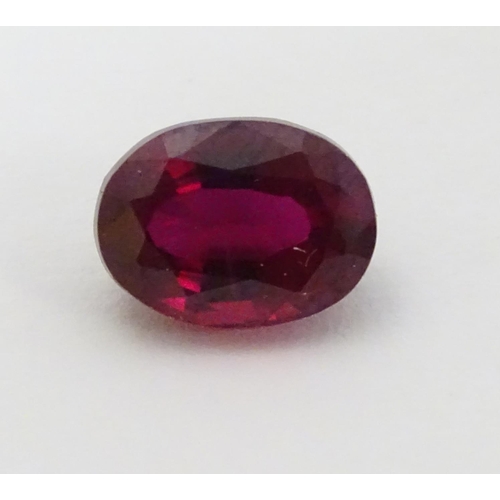 351 - Unmounted stone: A red oval cut Ruby. approx 8.20 ct, approx ½'' long