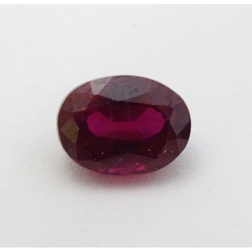 351 - Unmounted stone: A red oval cut Ruby. approx 8.20 ct, approx ½'' long