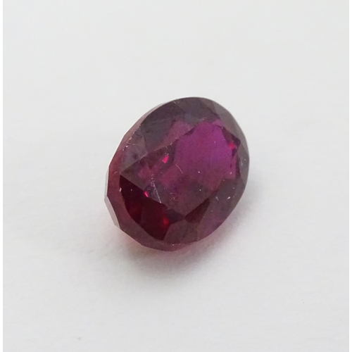 351 - Unmounted stone: A red oval cut Ruby. approx 8.20 ct, approx ½'' long