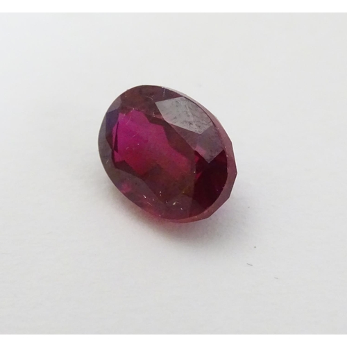 351 - Unmounted stone: A red oval cut Ruby. approx 8.20 ct, approx ½'' long