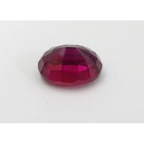 351 - Unmounted stone: A red oval cut Ruby. approx 8.20 ct, approx ½'' long