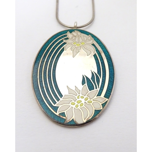 355 - A silver 'Save a Wildflower' pendant with enamel decoration. Hallmarked Birmingham 1977 maker Frankl... 