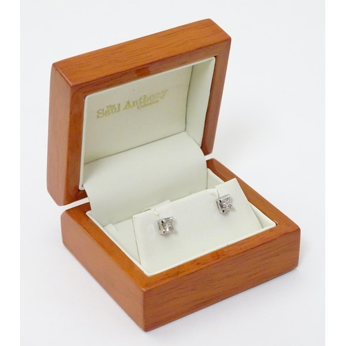 359 - A pair 18ct white gold diamond solitaire earrings. Each diamond 0.50ct