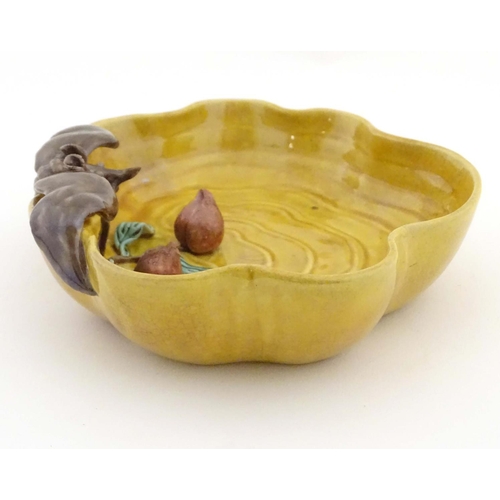 36 - A Chinese wavy edged yellow brush wash dish with bat and fruit decoration, Chinese character marks t... 