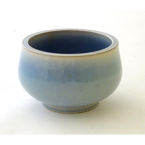 37 - An unmarked high fired blue glazed bowl. Approx. 3'' high.