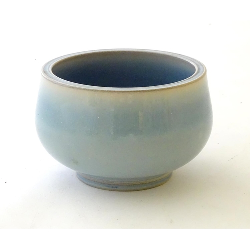 37 - An unmarked high fired blue glazed bowl. Approx. 3'' high.