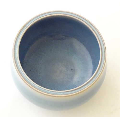 37 - An unmarked high fired blue glazed bowl. Approx. 3'' high.