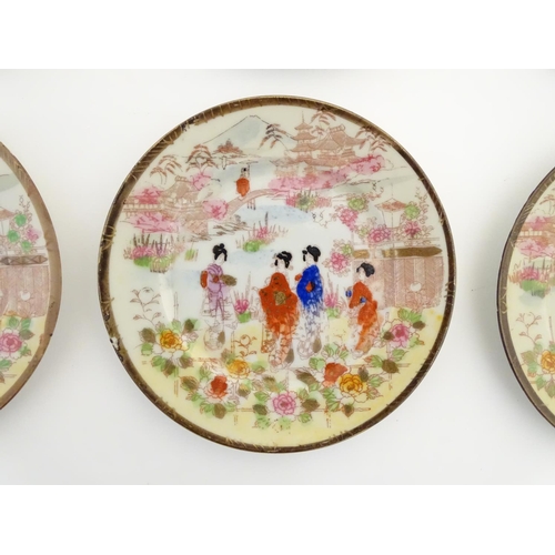 38 - Six Japanese plates depicting figures in traditional dress in an Oriental landscape depicting Mount ... 