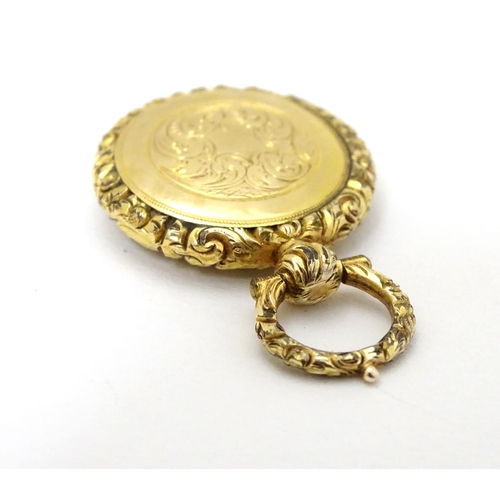 381 - A 19thC pinchbeck locket pendant, approx 7/8'' diameter