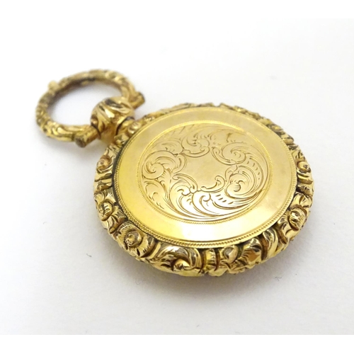 381 - A 19thC pinchbeck locket pendant, approx 7/8'' diameter