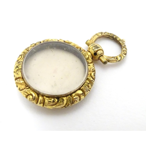 381 - A 19thC pinchbeck locket pendant, approx 7/8'' diameter