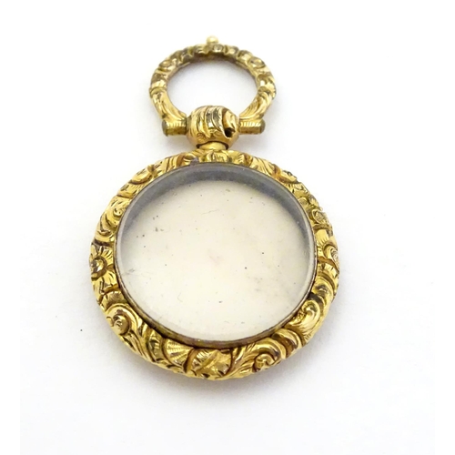 381 - A 19thC pinchbeck locket pendant, approx 7/8'' diameter