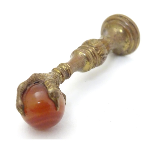 383 - A hand seal, the handle formed as a birds claw holding an agate sphere 2 1/2'' high