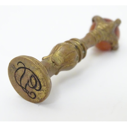 383 - A hand seal, the handle formed as a birds claw holding an agate sphere 2 1/2'' high