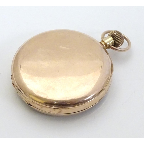 394 - 9 ct Gold Pocketwatch: a top wind pocket watch with enamel dial signed 'Specially examined 15 jewell... 