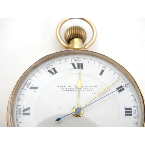 394 - 9 ct Gold Pocketwatch: a top wind pocket watch with enamel dial signed 'Specially examined 15 jewell... 