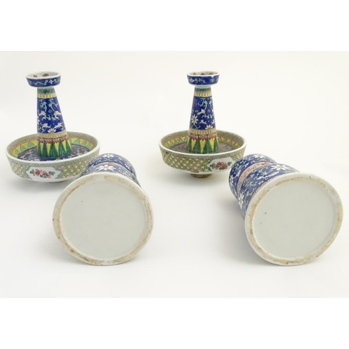 40 - A pair of two-sectional Chinese vases decorated with floral and foliate scrolls. Approx. 17 ¾'' high... 