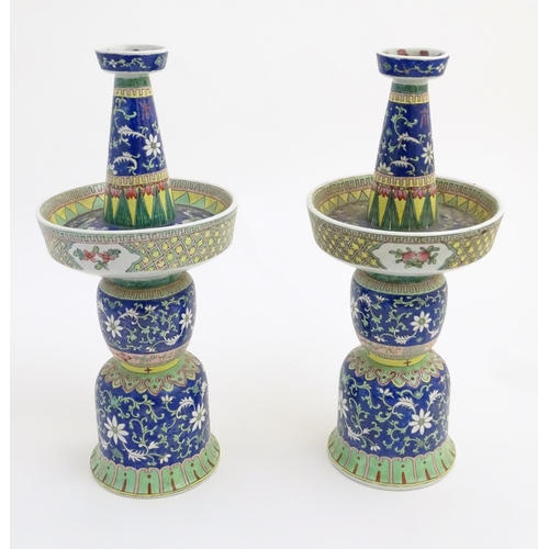 40 - A pair of two-sectional Chinese vases decorated with floral and foliate scrolls. Approx. 17 ¾'' high... 