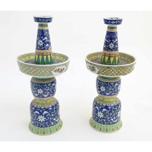 40 - A pair of two-sectional Chinese vases decorated with floral and foliate scrolls. Approx. 17 ¾'' high... 