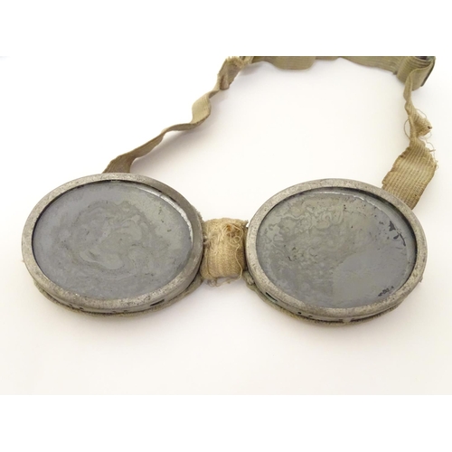 405 - Militaria: a pair of Second World War/WW2 Alpine goggles, of aluminium construction with elasticated... 