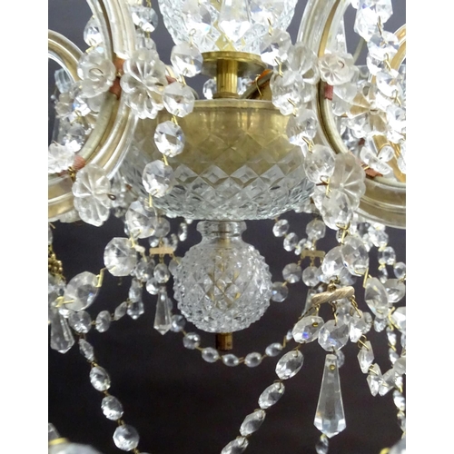 440 - Chandelier: a glass 6 branch pendant electrolier with brass fitments, 22'' wide x 16'' high.