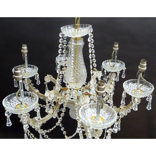 440 - Chandelier: a glass 6 branch pendant electrolier with brass fitments, 22'' wide x 16'' high.