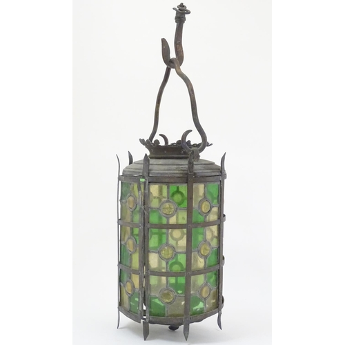 444A - A late 19thC continental stained and leaded glass (with bullseyes) cylindrical pendant lamp, with a ... 